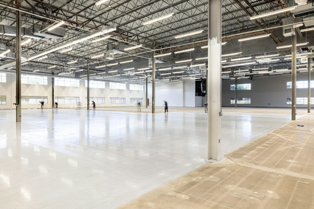 Empty warehouse interior with polished concrete floor